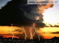 lightning storm over city lights